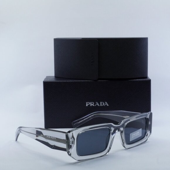 Prada PR06YS 12R09T Rectangle Sunglasses – Transparent Grey\\Dark Grey